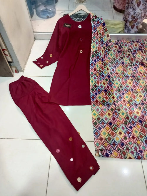 Three-piece women's stitched suit set featuring embroidered lawn fabric with intricate details and matching dupatta by Suitloom.